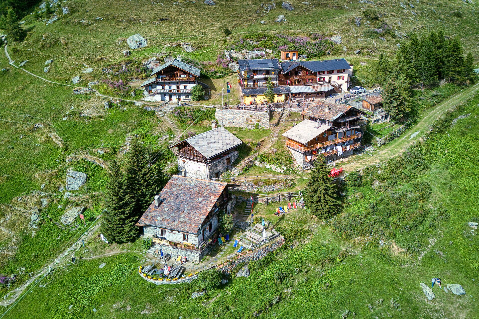 Historic stone-and-timber Rifugio Ferraro in the green Resy hamlet above Val d’Ayas.