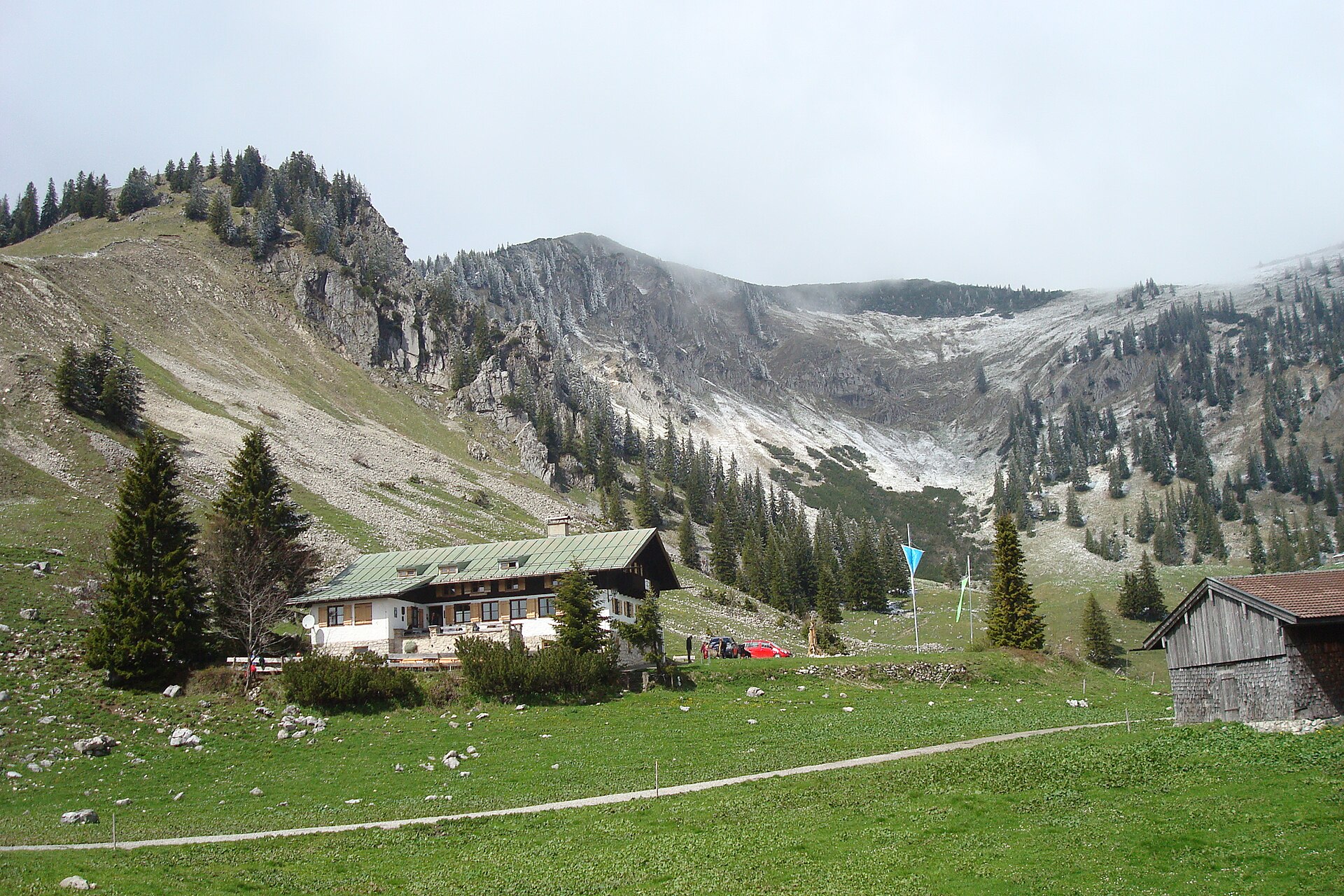 Schönfeldhütte in gentle green alpine pasture above Spitzingsee in Bavaria.